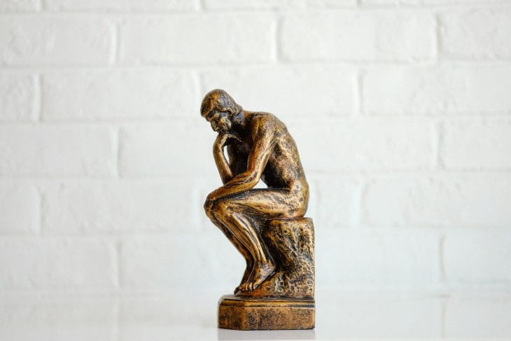 brown concrete statue of man that's worrying