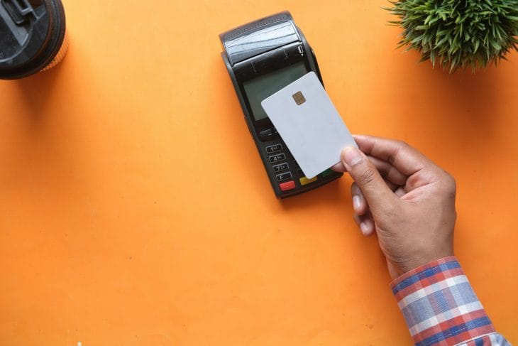person buying something with credit card