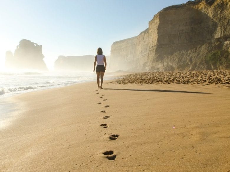 woman walking on shore