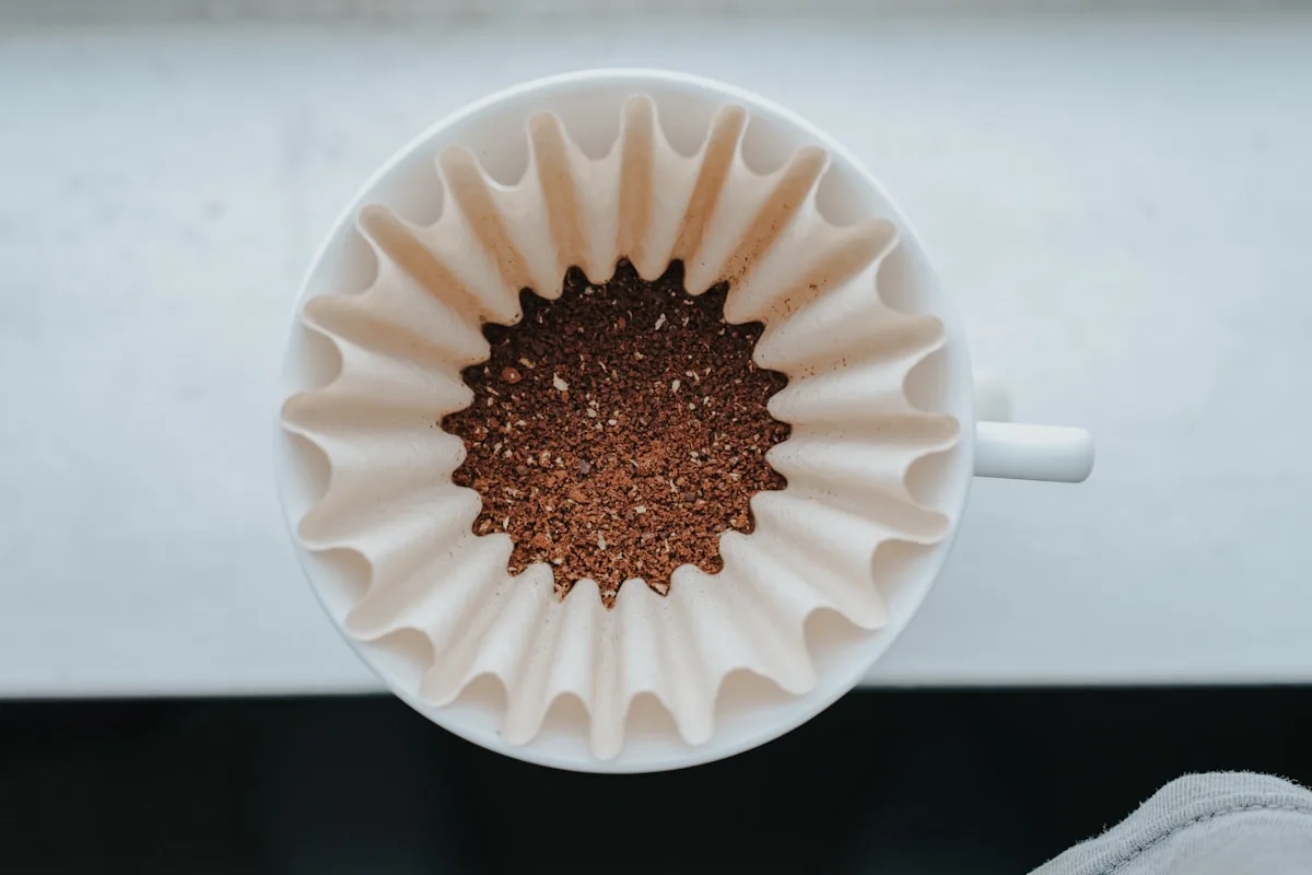 white muffin tray on top of white ceramic mug